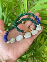 Charger l&#39;image dans la galerie, Malachite Lapis Lazuli Baroque Pearl Necklace shown outdoors with natural leaf background, handcrafted in Canada.
