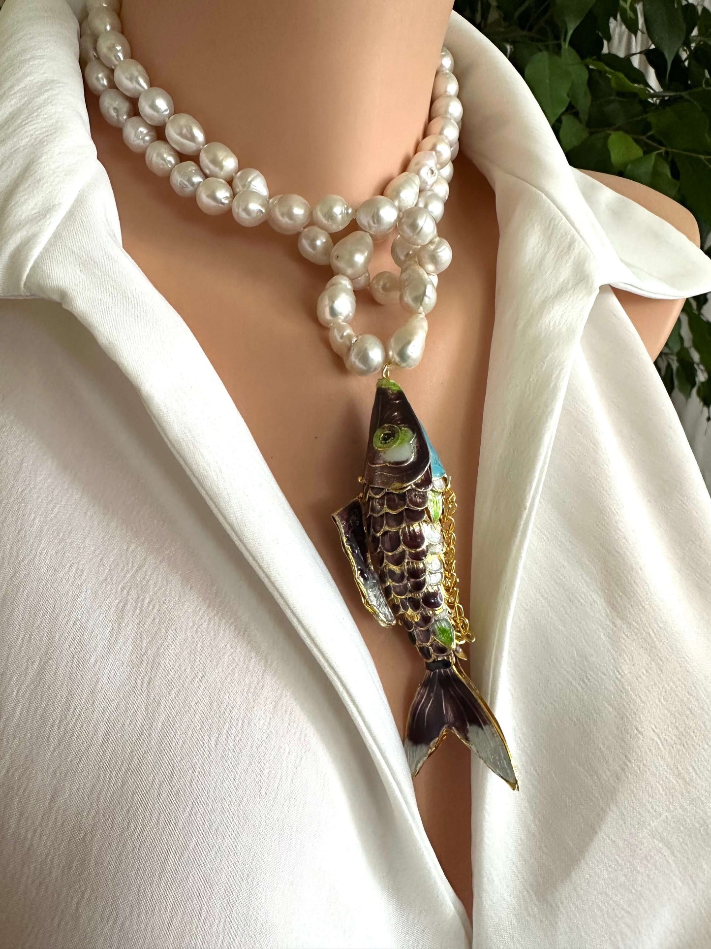Koi fish pearl necklace with baroque pearls, showcasing a burgundy cloisonné koi fish pendant on a model.