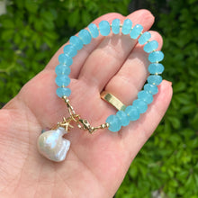 Load image into Gallery viewer, Chalcedony bracelet featuring aqua blue beads, starfish charm, and baroque pearl, showcasing ocean-inspired elegance.
