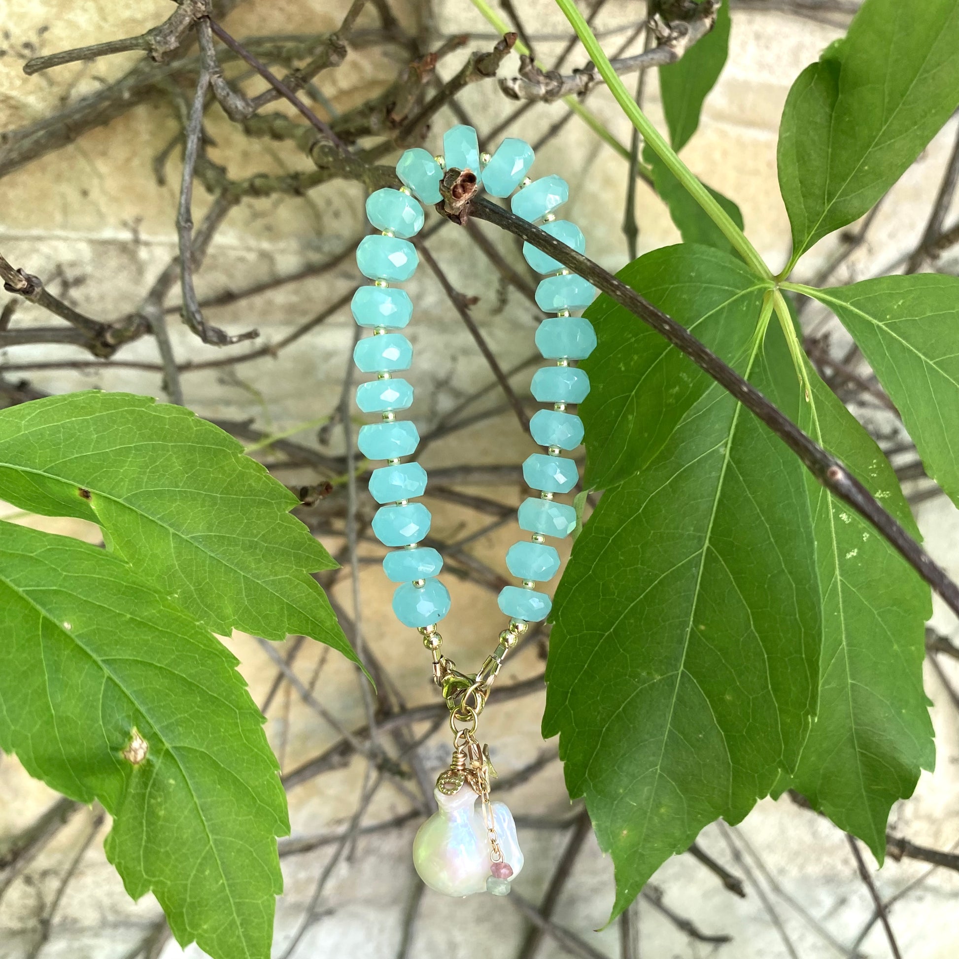 Chalcedony bracelet with starfish and baroque pearl charm, featuring aqua blue beads and a natural ocean-inspired aesthetic.