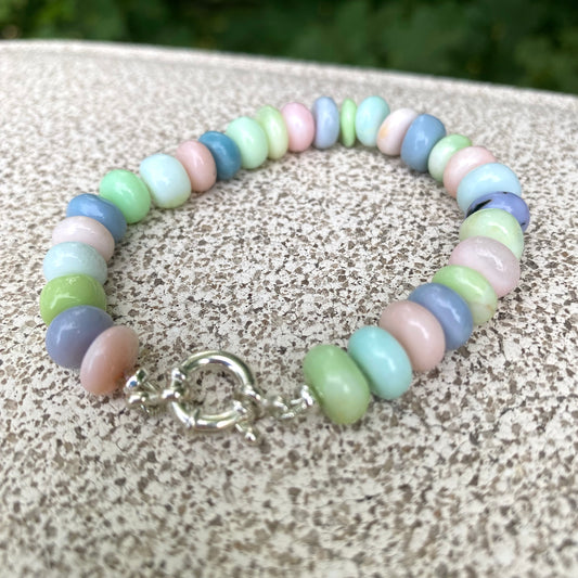 Opal candy bracelet featuring multi color pastel Peruvian opal rondelle beads in soft hues of green, pink, blue, and purple.