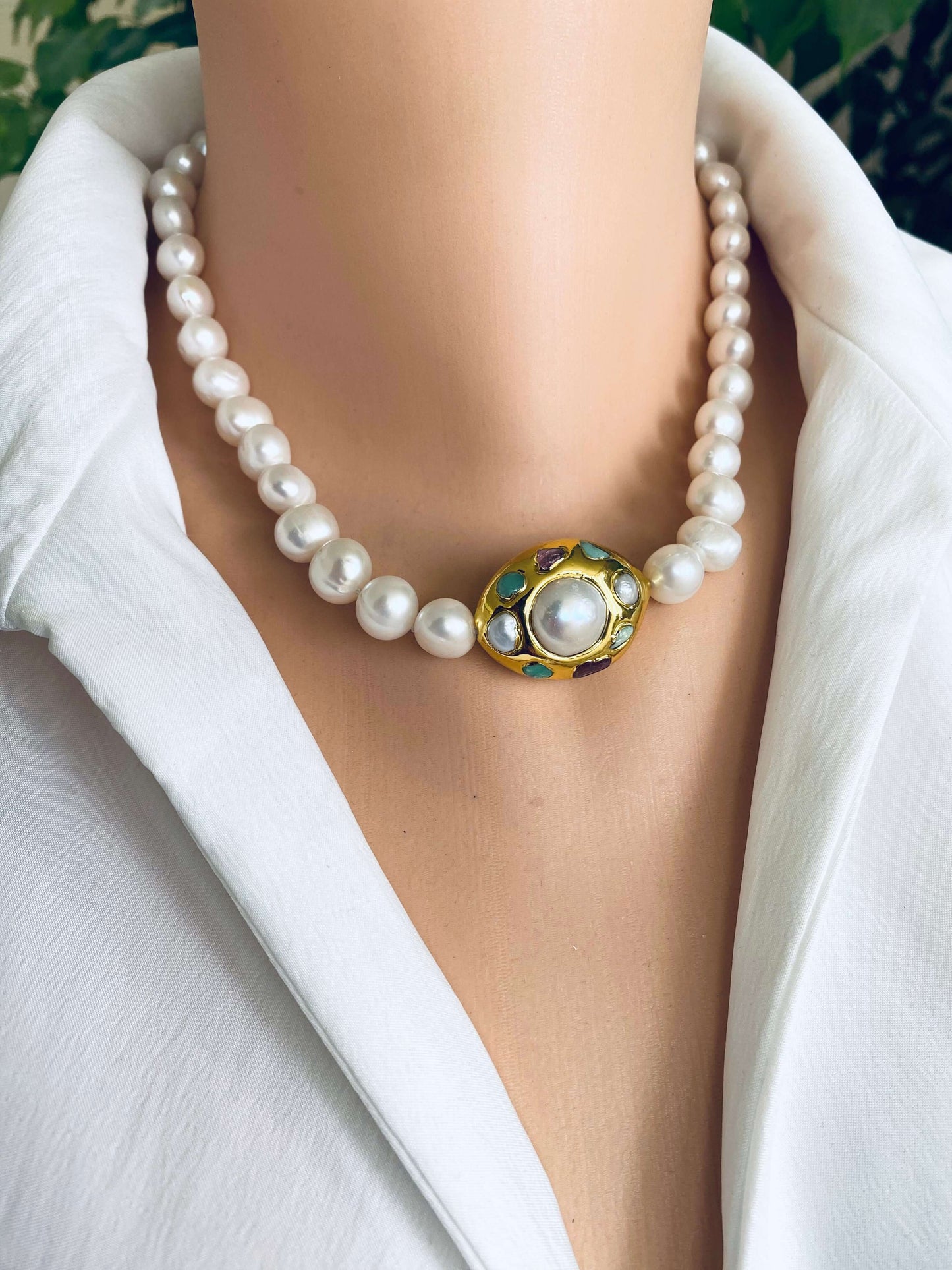 White pearl necklace with gold accent featuring hand-knotted freshwater pearls and an 18kt gold-plated focal accent.