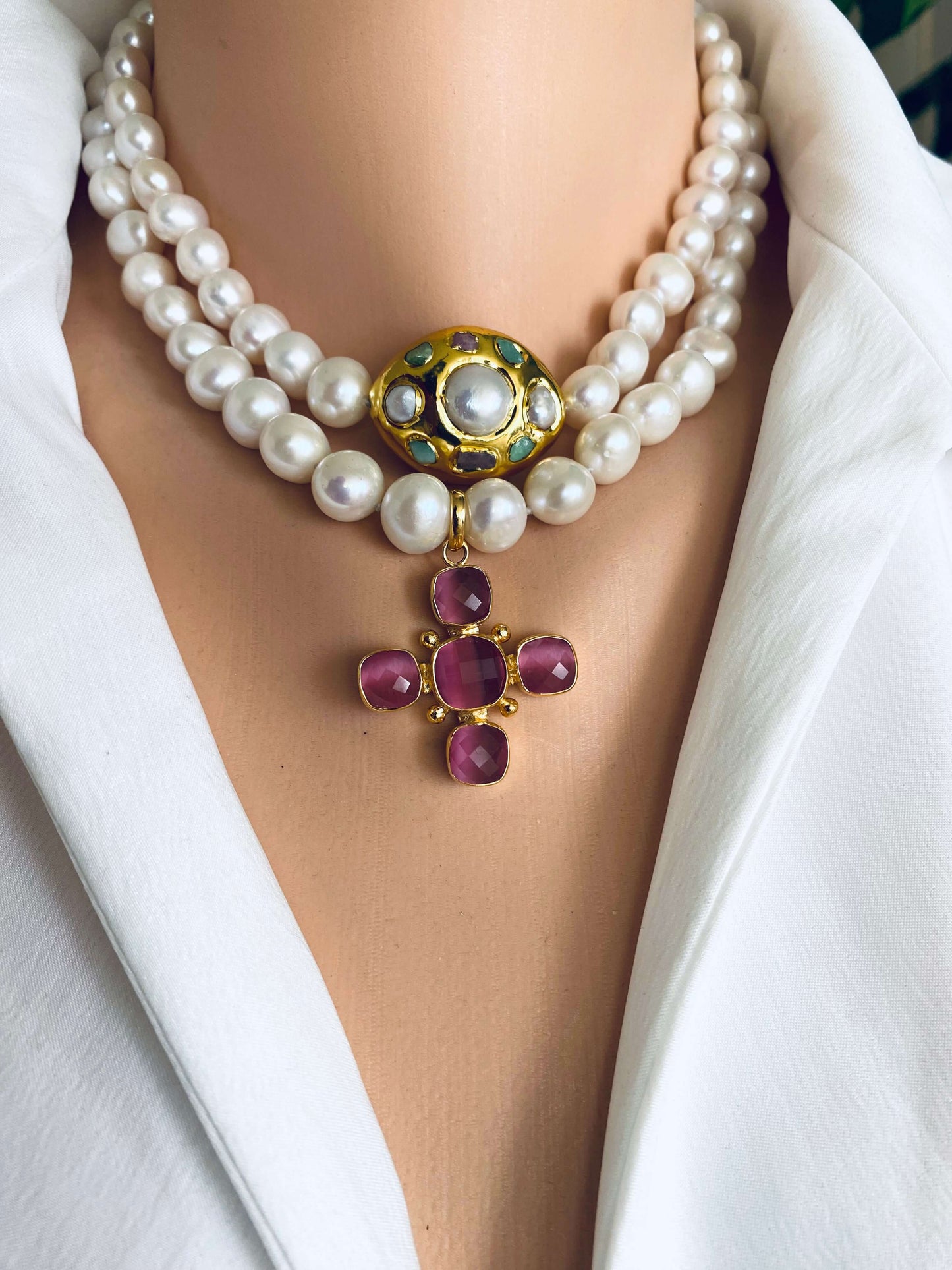 White potato pearl necklace with cross pendant showcasing luminous freshwater pearls and a decorative golden cross charm.