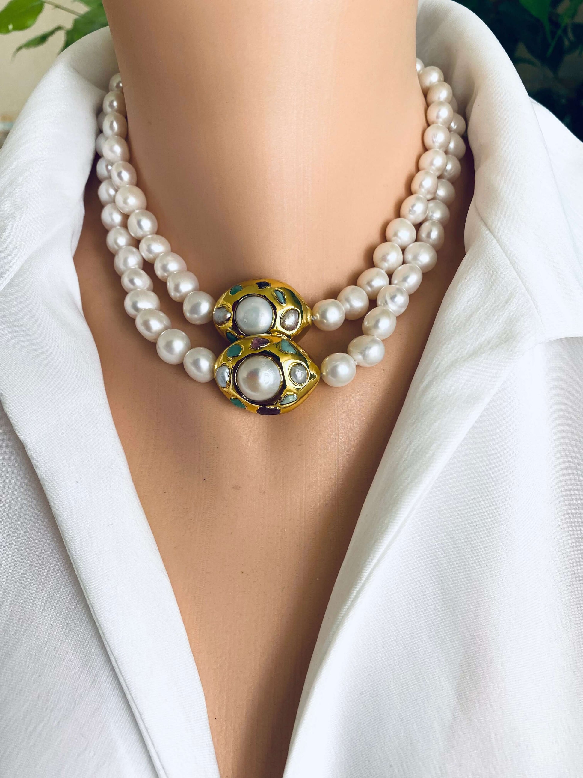 White pearl necklace with gold accent featuring double strands of freshwater pearls and a decorative gold focal accent.