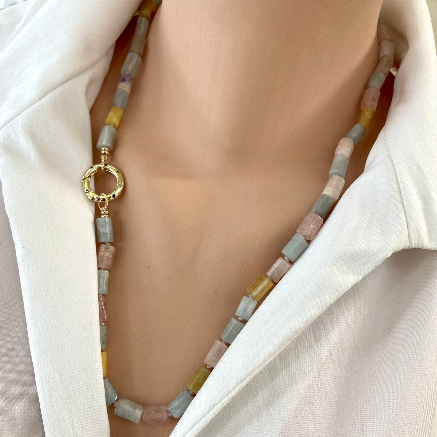 Beryl gemstone necklace featuring aquamarine and morganite with artisanal craftsmanship, showcased on a model.