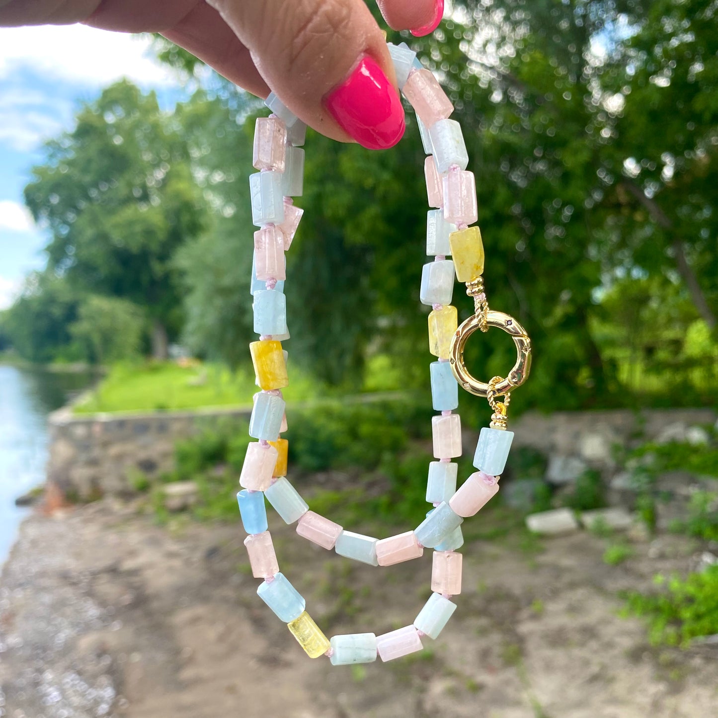 Beryl gemstone necklace featuring aquamarine and morganite, showcasing pastel tones in a beautiful handcrafted design.