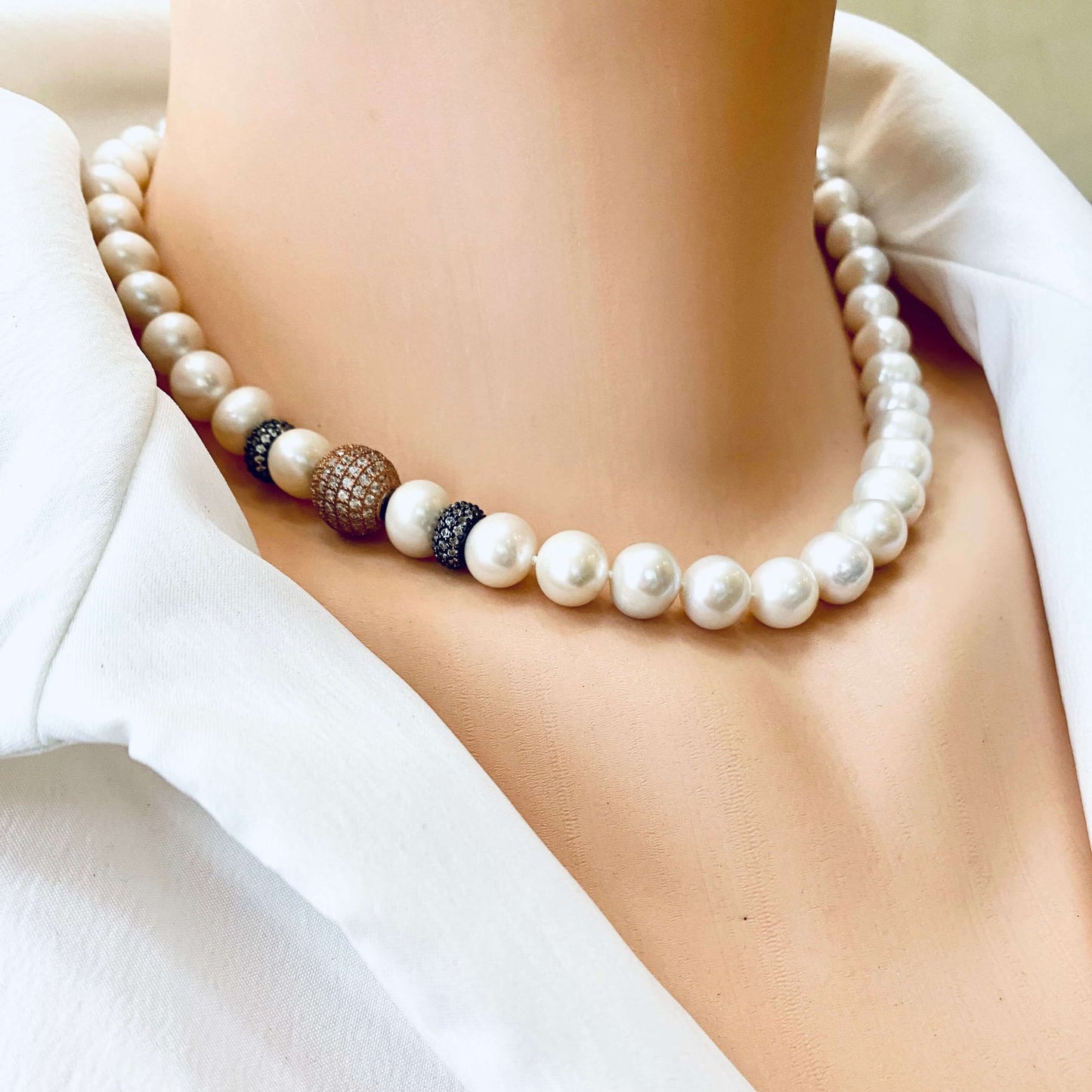 Rose gold pearl necklace worn by mannequin, elegant bridal jewelry for weddings.