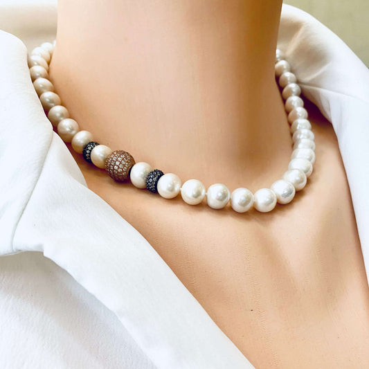 Rose gold pearl necklace worn by mannequin, elegant bridal jewelry for weddings.