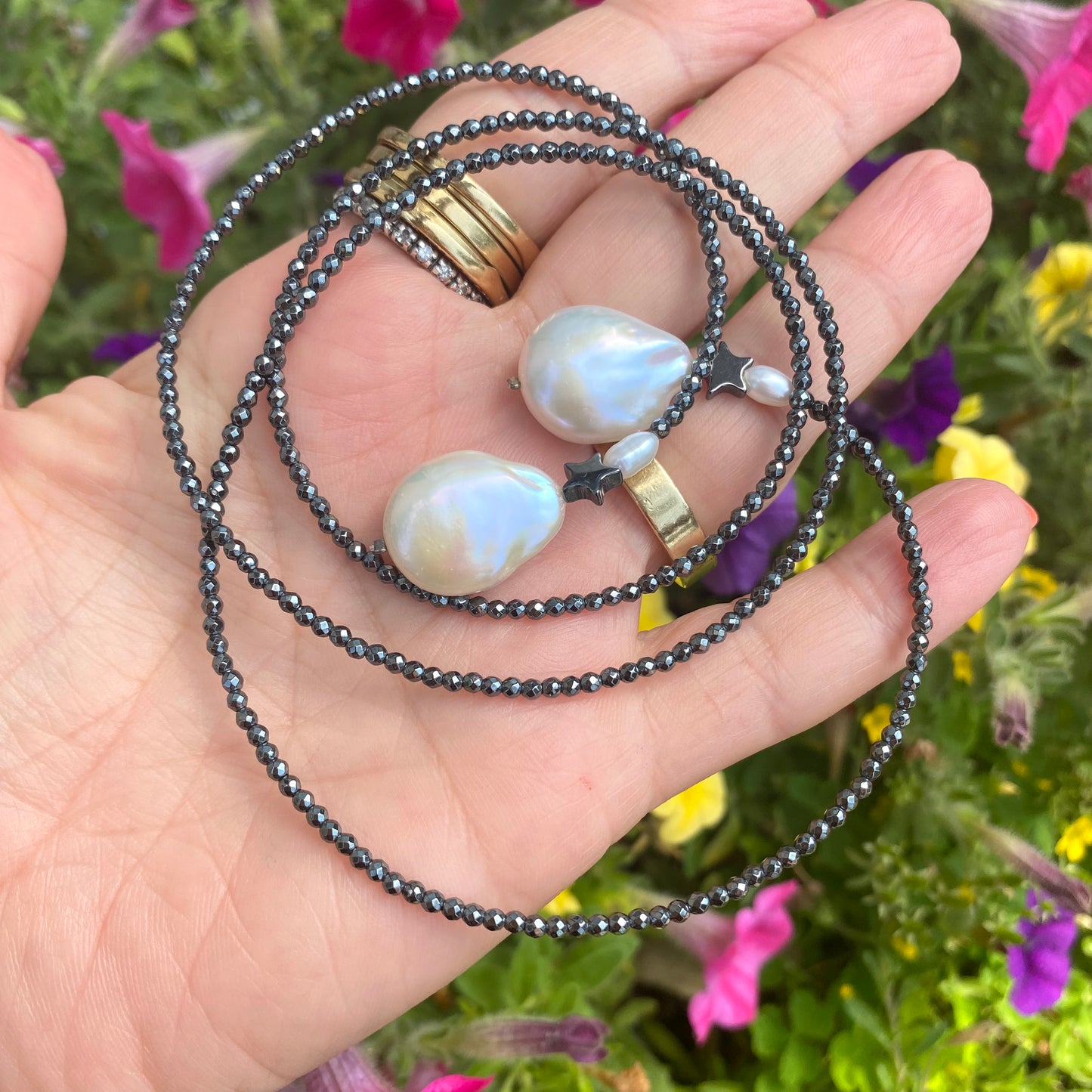 Hematite baroque pearl lariat necklace close-up showing organic baroque pearl contrast