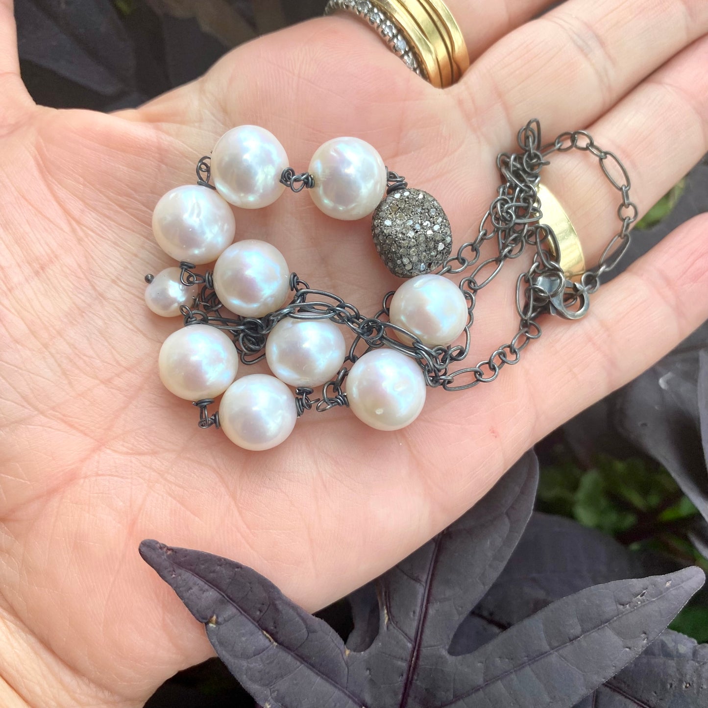 Pearl necklace wire wrapped in silver, featuring high-lustre freshwater pearls, handcrafted in Canada.