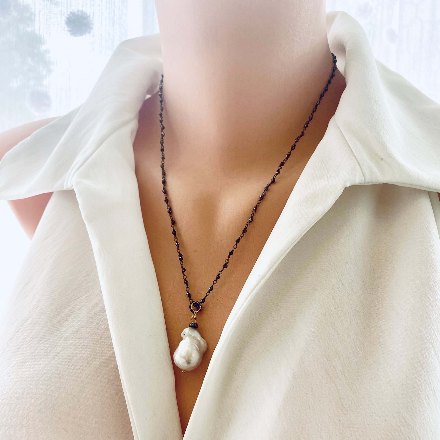 Front view of pyrite rosary chain necklace on mannequin showing oxidized silver links and pearls