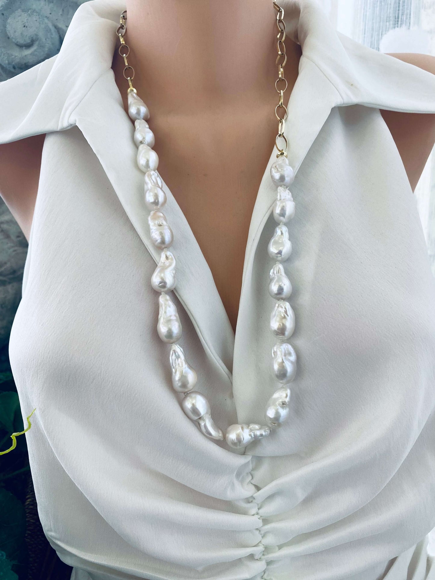 Baroque pearl gold chain necklace on mannequin — front view showing bold asymmetric design of handcrafted pearl jewelry by Loulia Pearl Jewelry