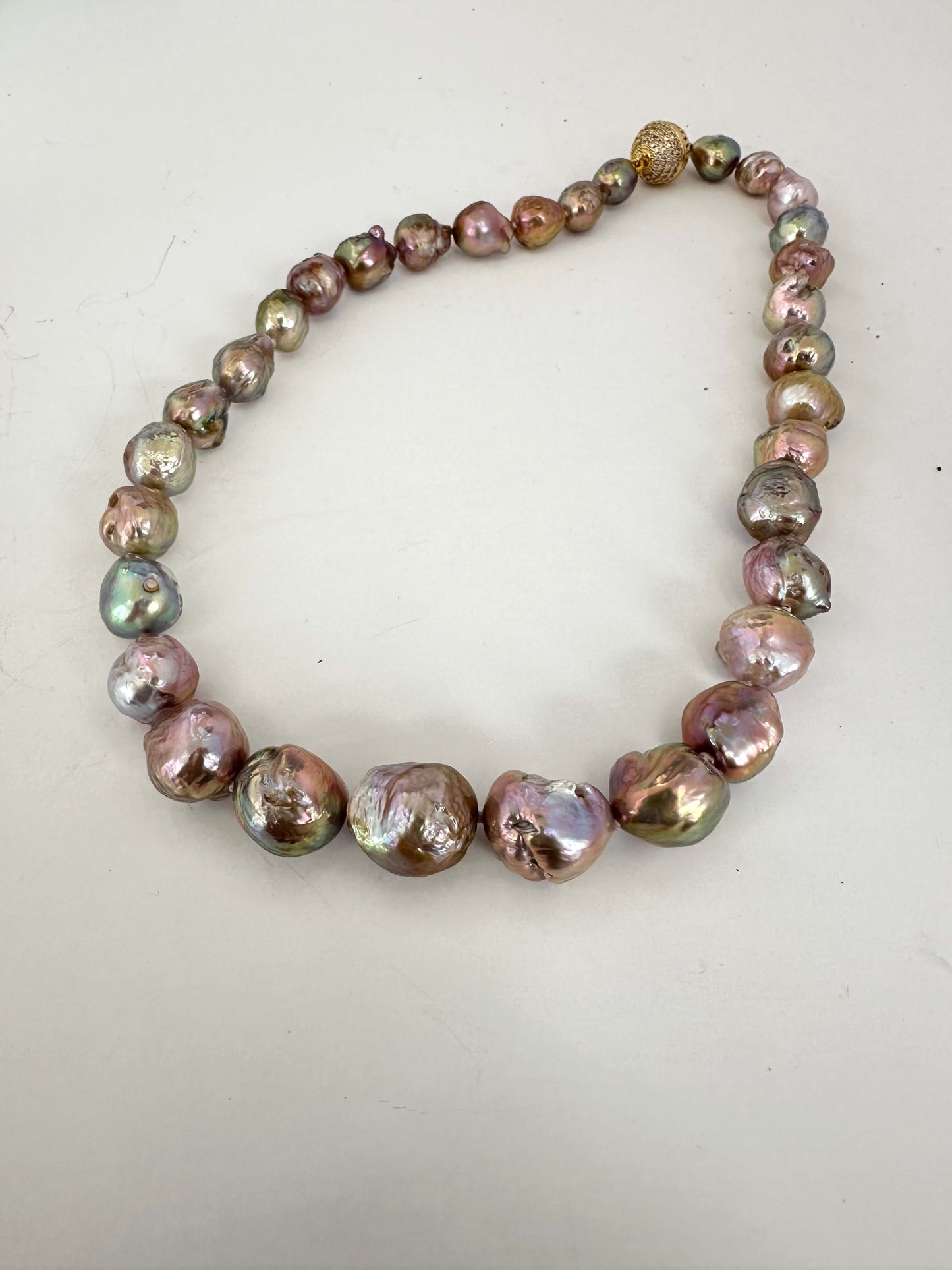 Edison pearl necklace with magnetic clasp shown flat highlighting metallic baroque pearls