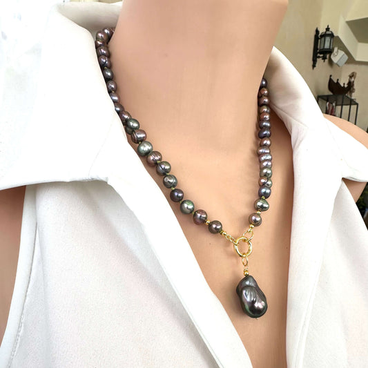 Handcrafted black pearl necklace with peacock luster and removable baroque pendant shown in side view