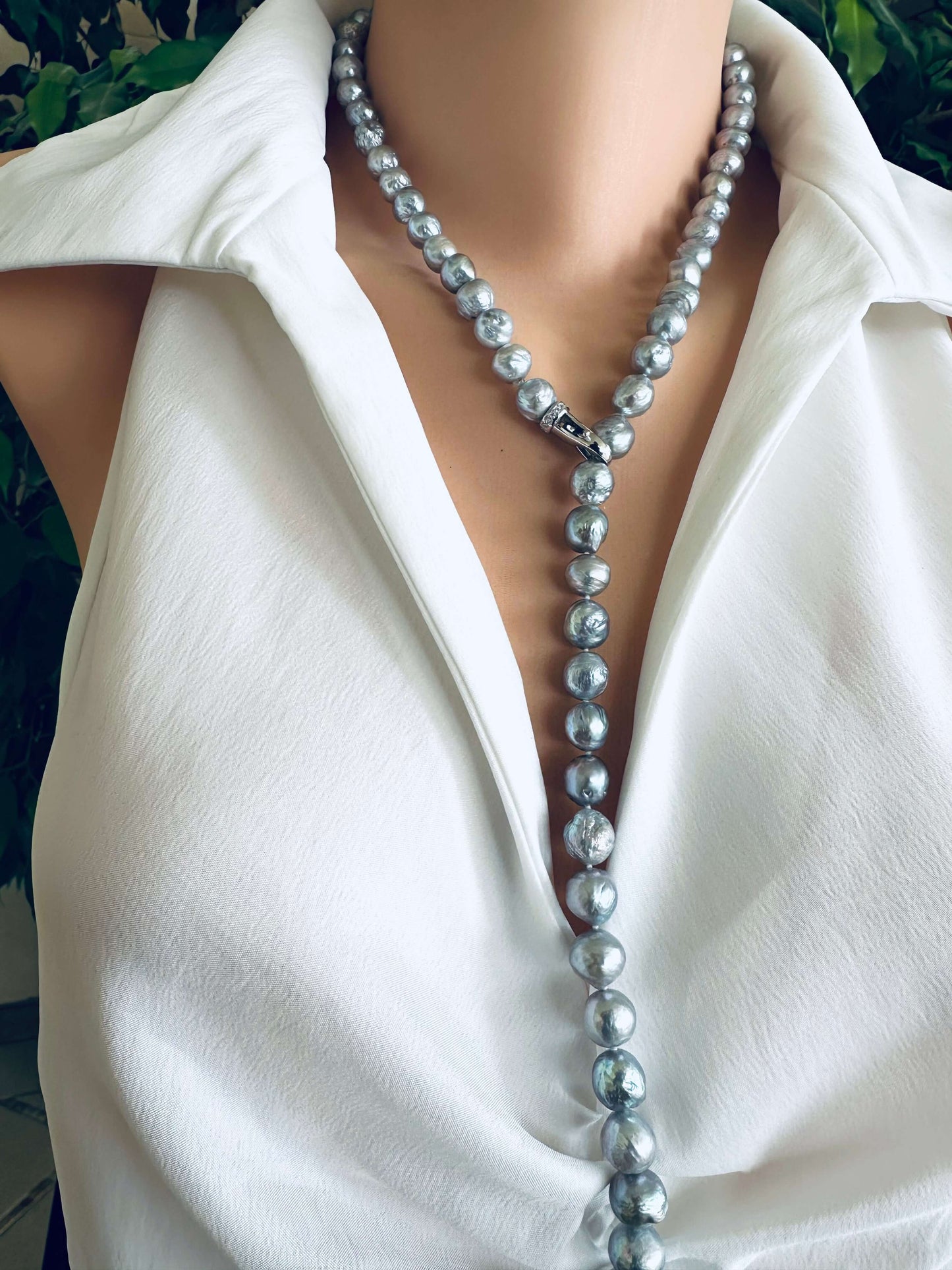 Grey Edison baroque pearl necklace worn as Y necklace with adjustable drop on white blouse