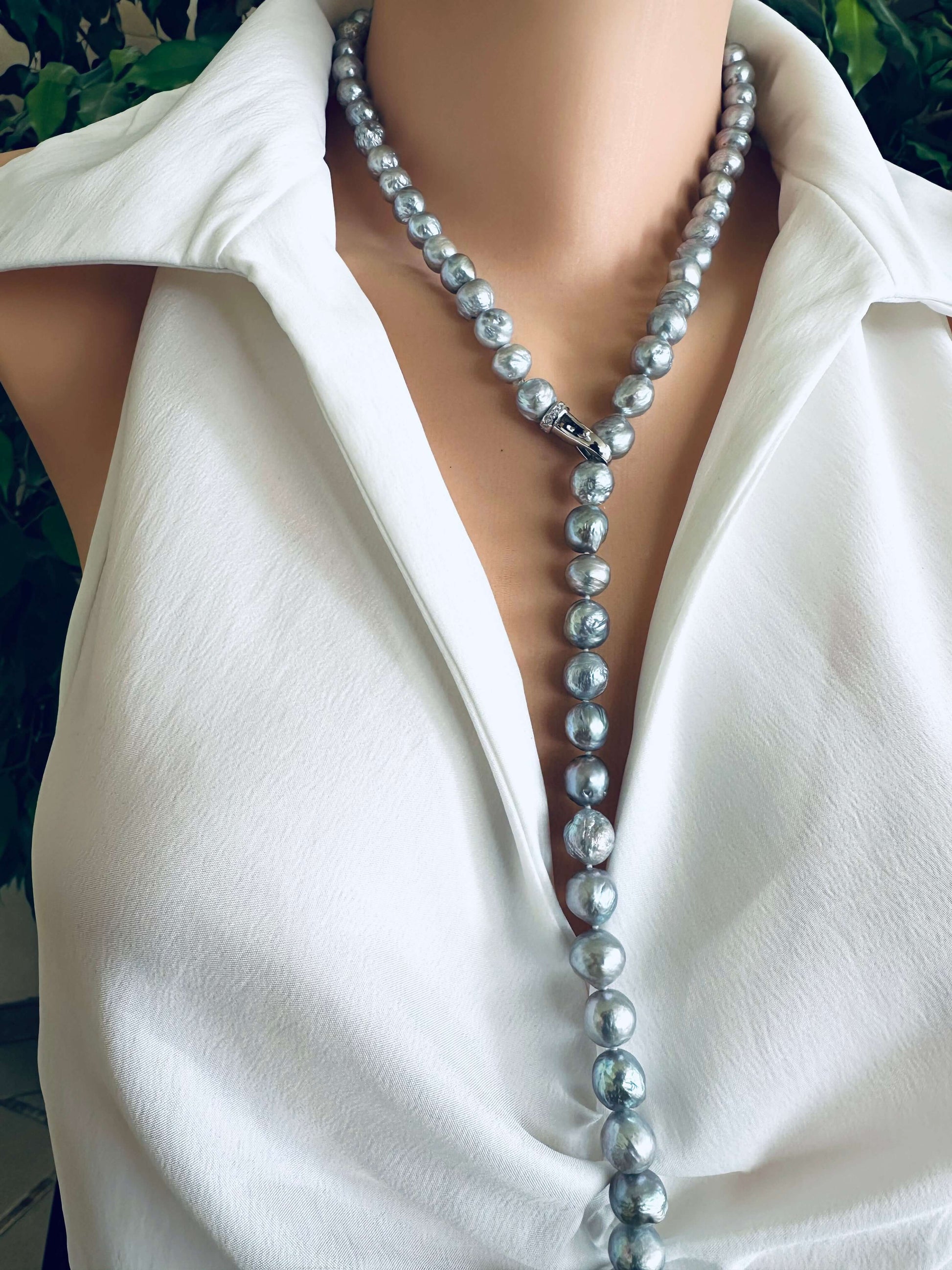 Grey Edison baroque pearl necklace worn as Y necklace with adjustable drop on white blouse