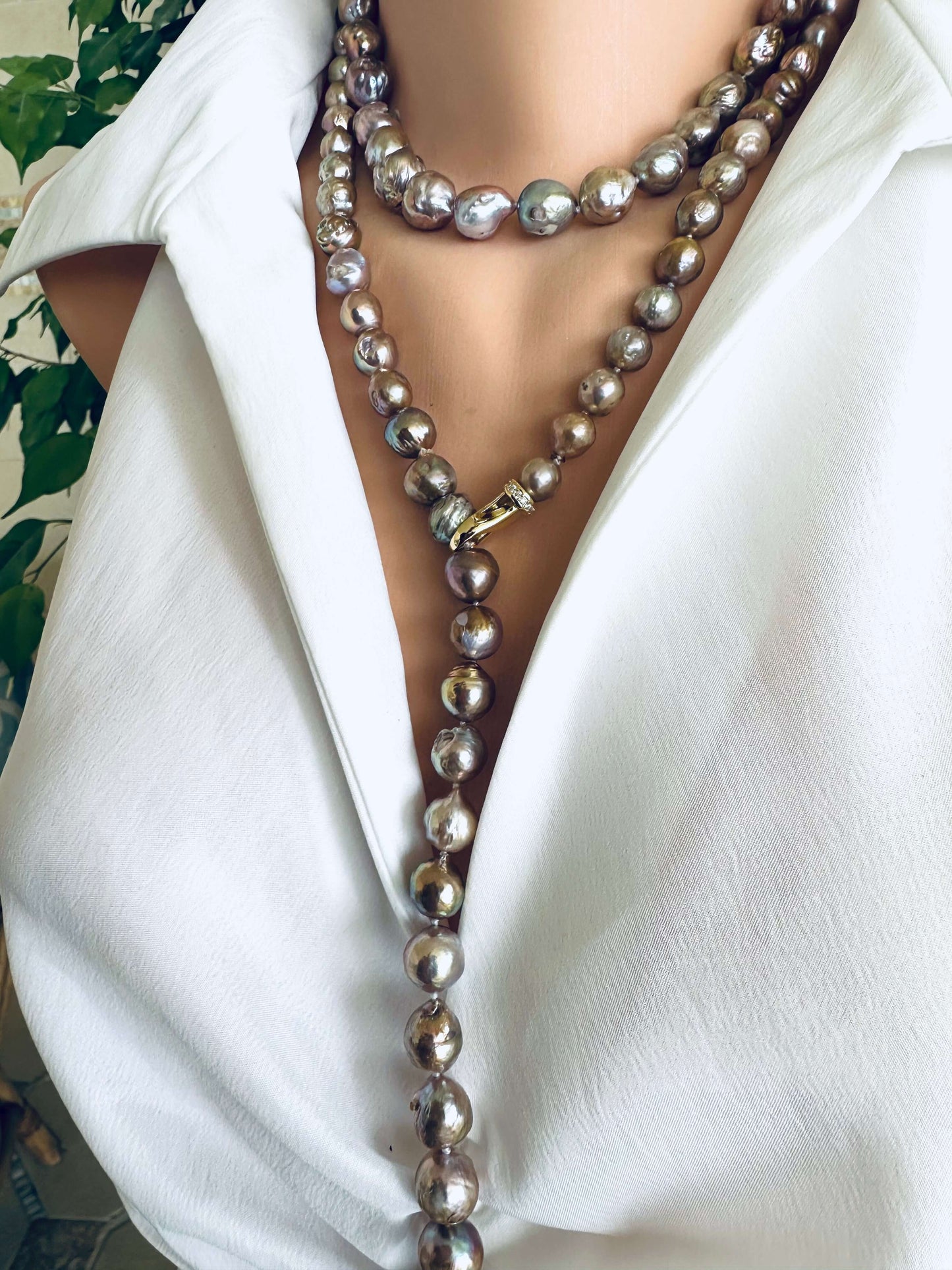 Pink Edison baroque pearl necklace styled as Y necklace with elongated silhouette