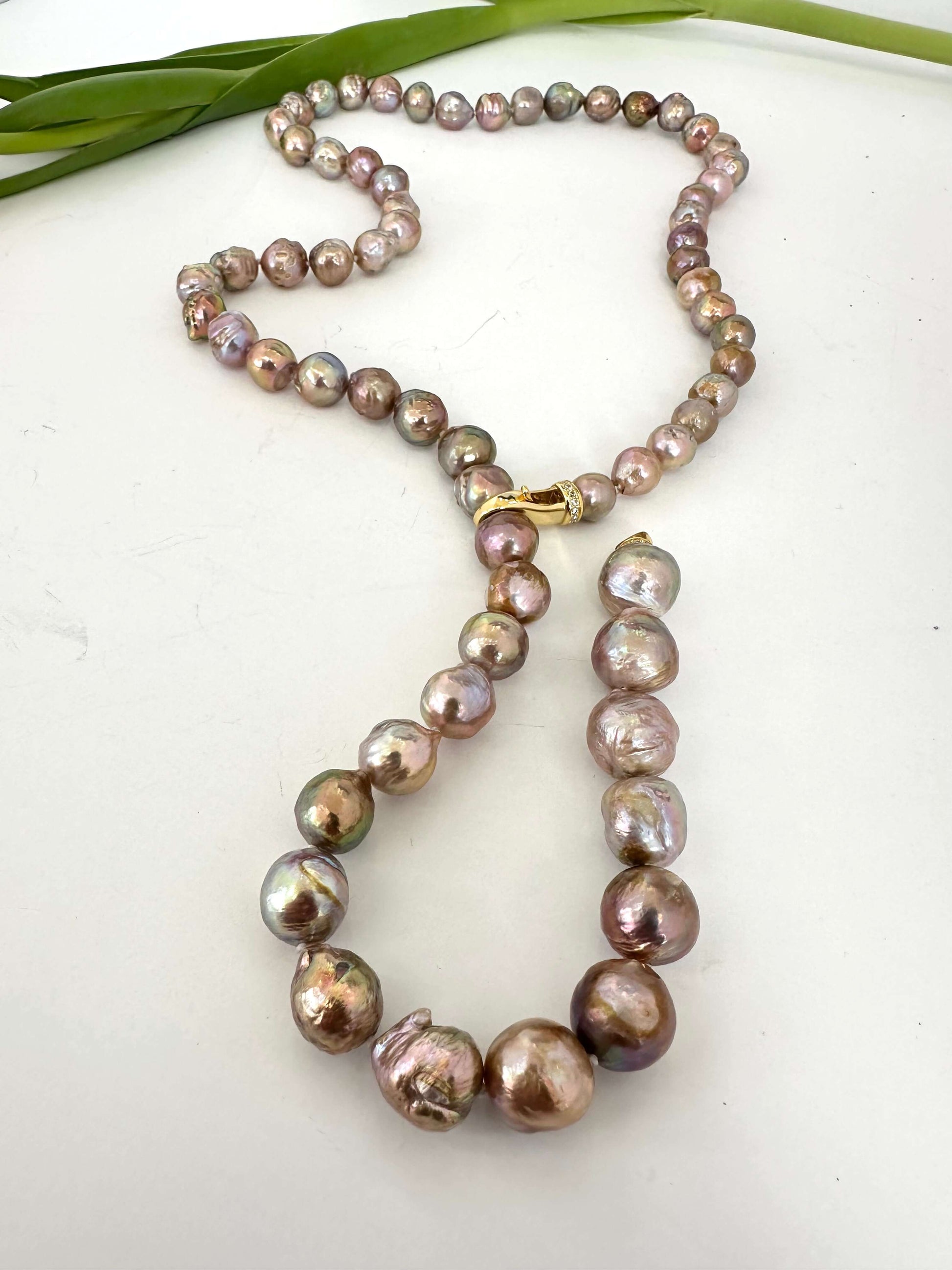 Pink Edison baroque pearl necklace flat lay highlighting baroque pearl texture and clasp