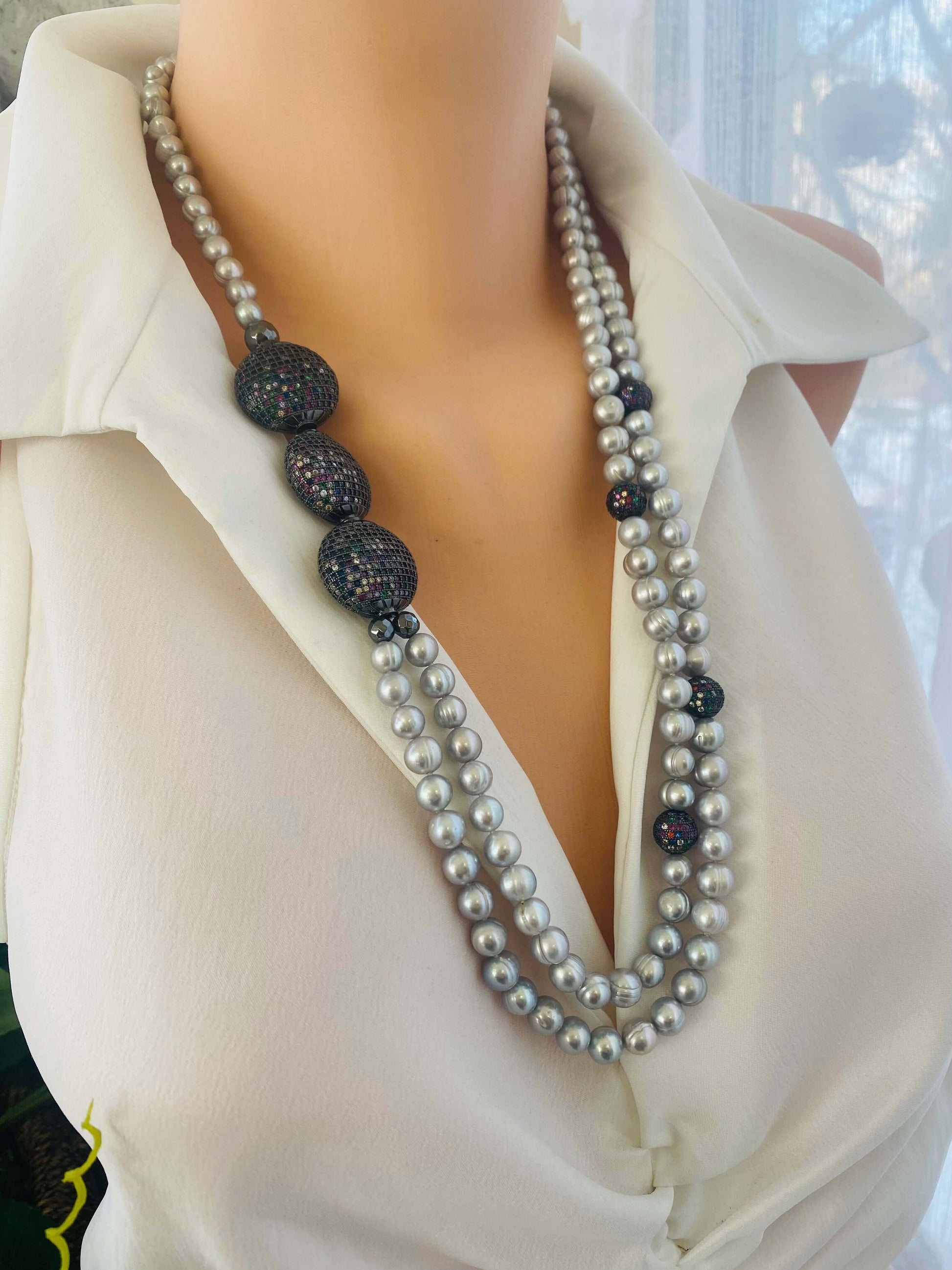 Elegant double-strand Grey Pearl Necklace with gunmetal CZ accents displayed on mannequin side angle.