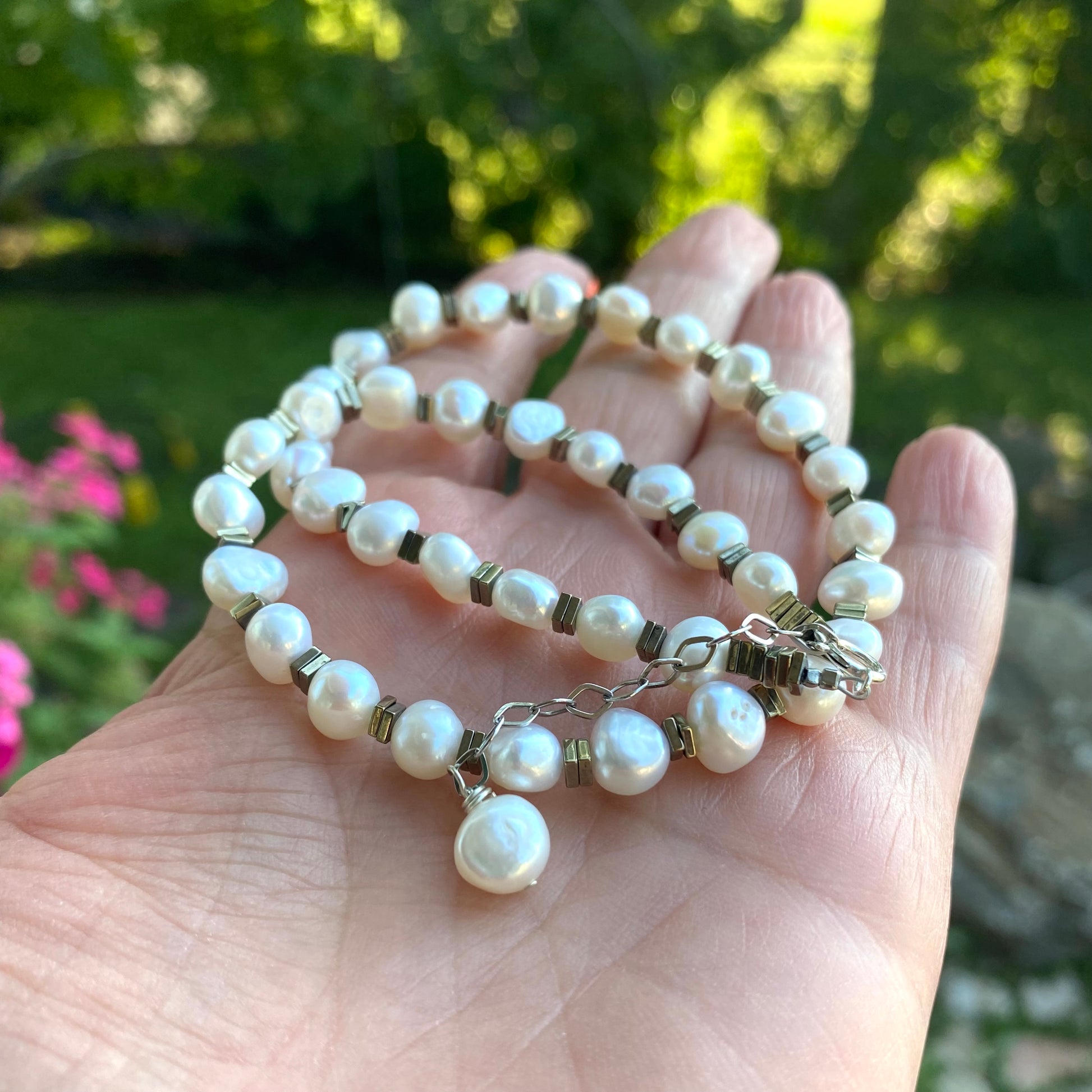 Pearl hematite choker necklace featuring white freshwater pearls and metallic hematite beads