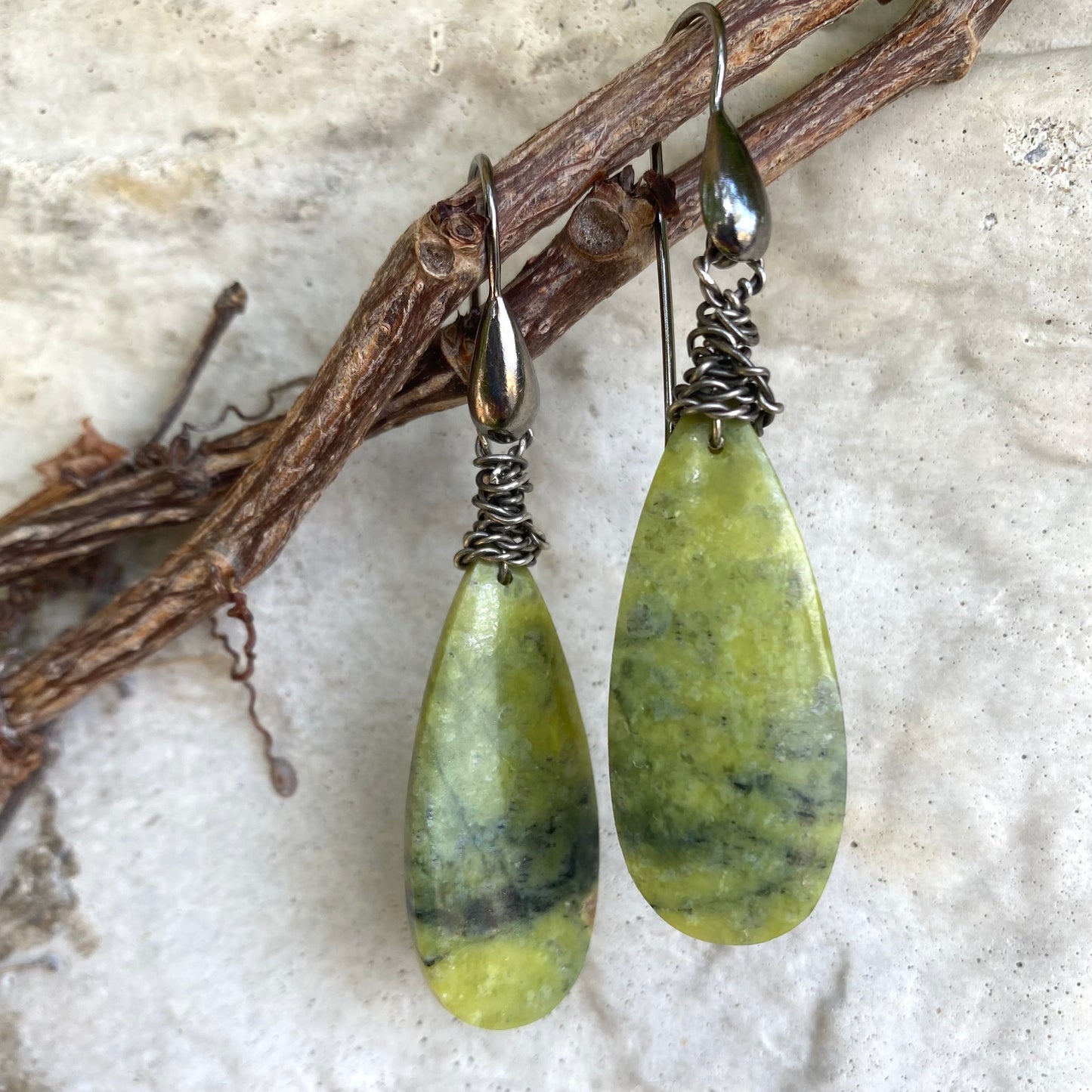 Bohemian green serpentine teardrop earrings with black rhodium hooks