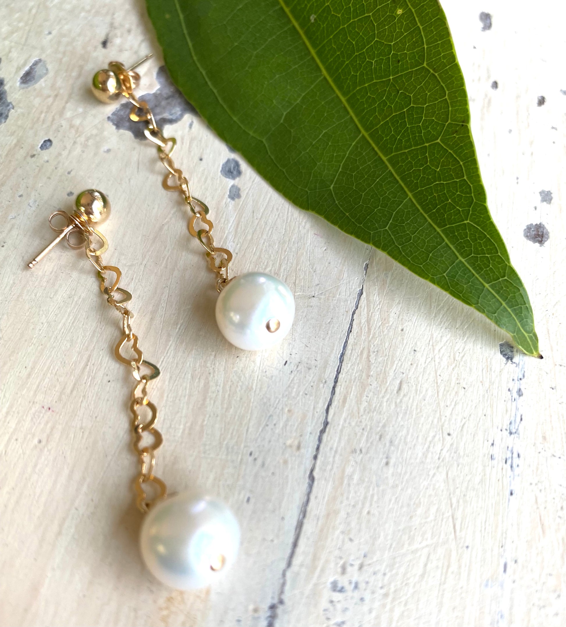 Pearl heart drop earrings featuring removable heart chain and freshwater pearl drops