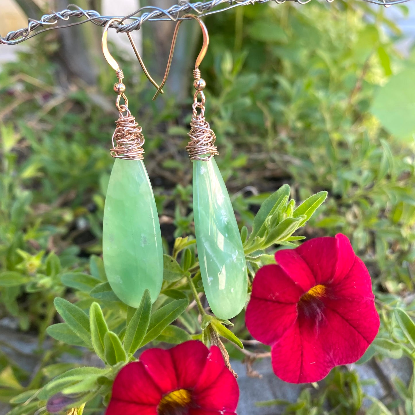 Teardrop green onyx earrings photographed outdoors emphasizing fresh green gemstone color