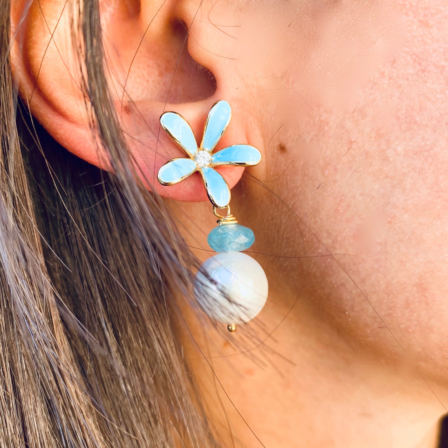 Edison Pearl Aquamarine Earrings – Blue Enamel Flower worn by a model showing their elegant design.