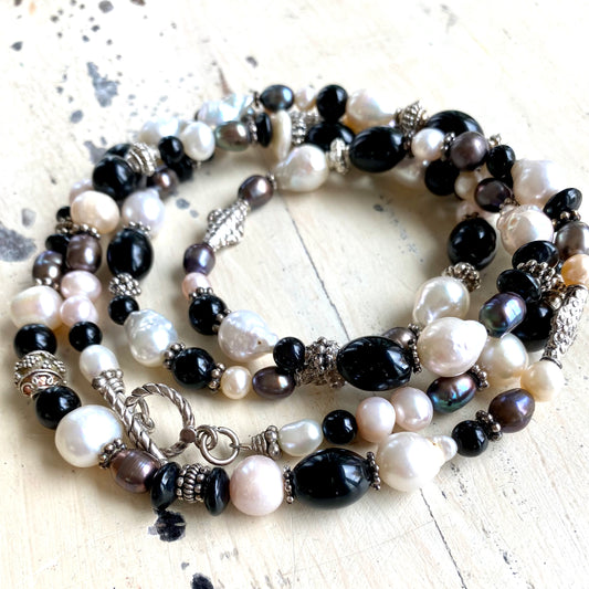 Black onyx pearl long necklace featuring freshwater black and white pearls and sterling silver beads