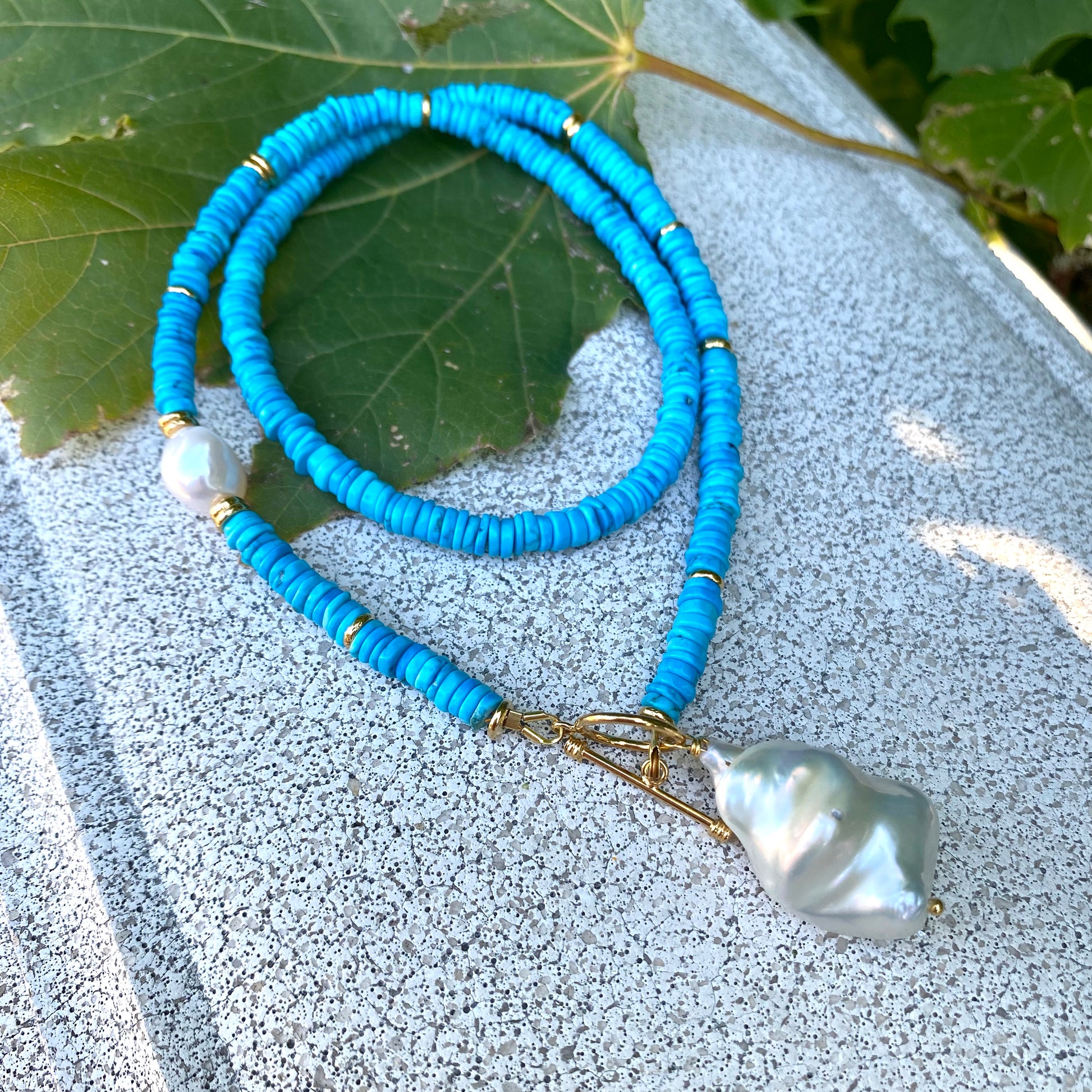 Turquoise Pearl Toggle Necklace with vibrant turquoise tire beads and baroque pearls, showcasing elegant handmade jewelry.