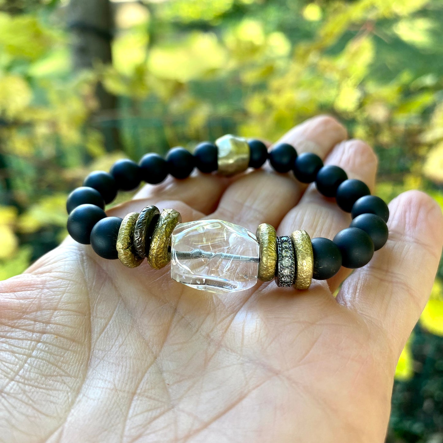 Crystal Quartz Onyx Bracelet showcasing bold black onyx beads and a clear rock crystal centerpiece.