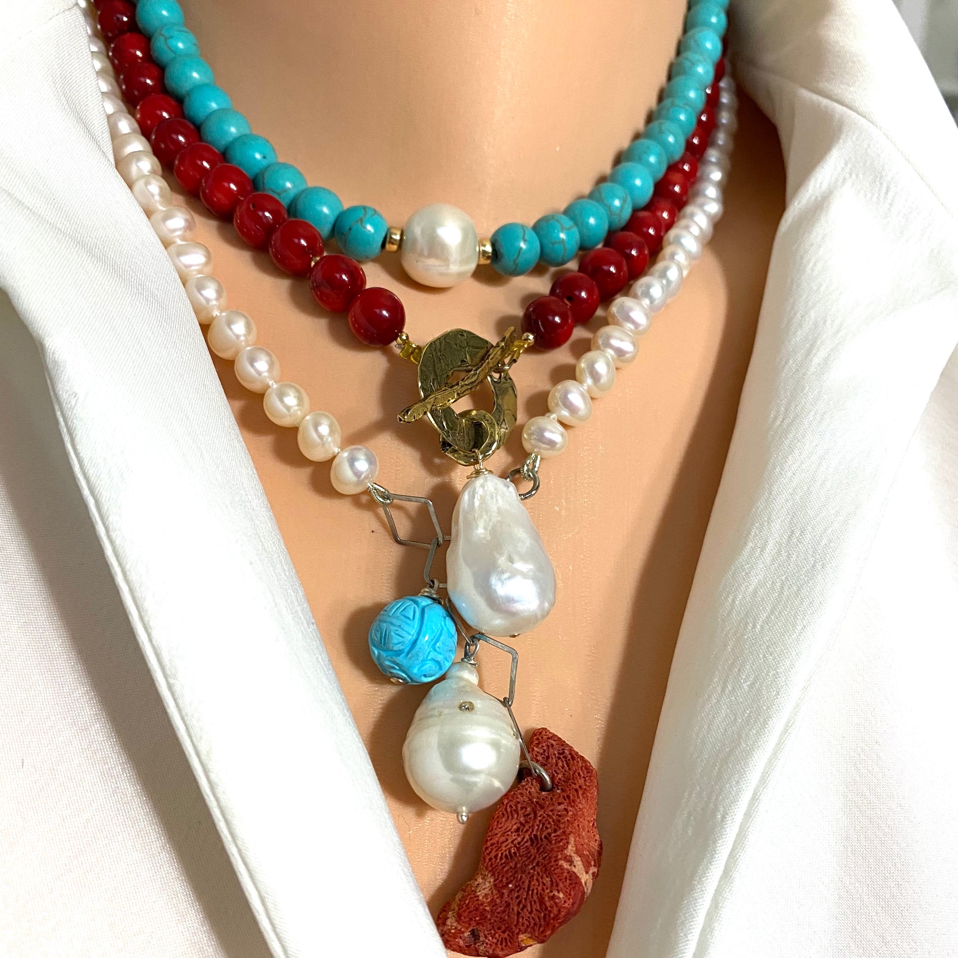 Turquoise howlite pearl choker necklace styled layered with gemstone and pearl necklaces