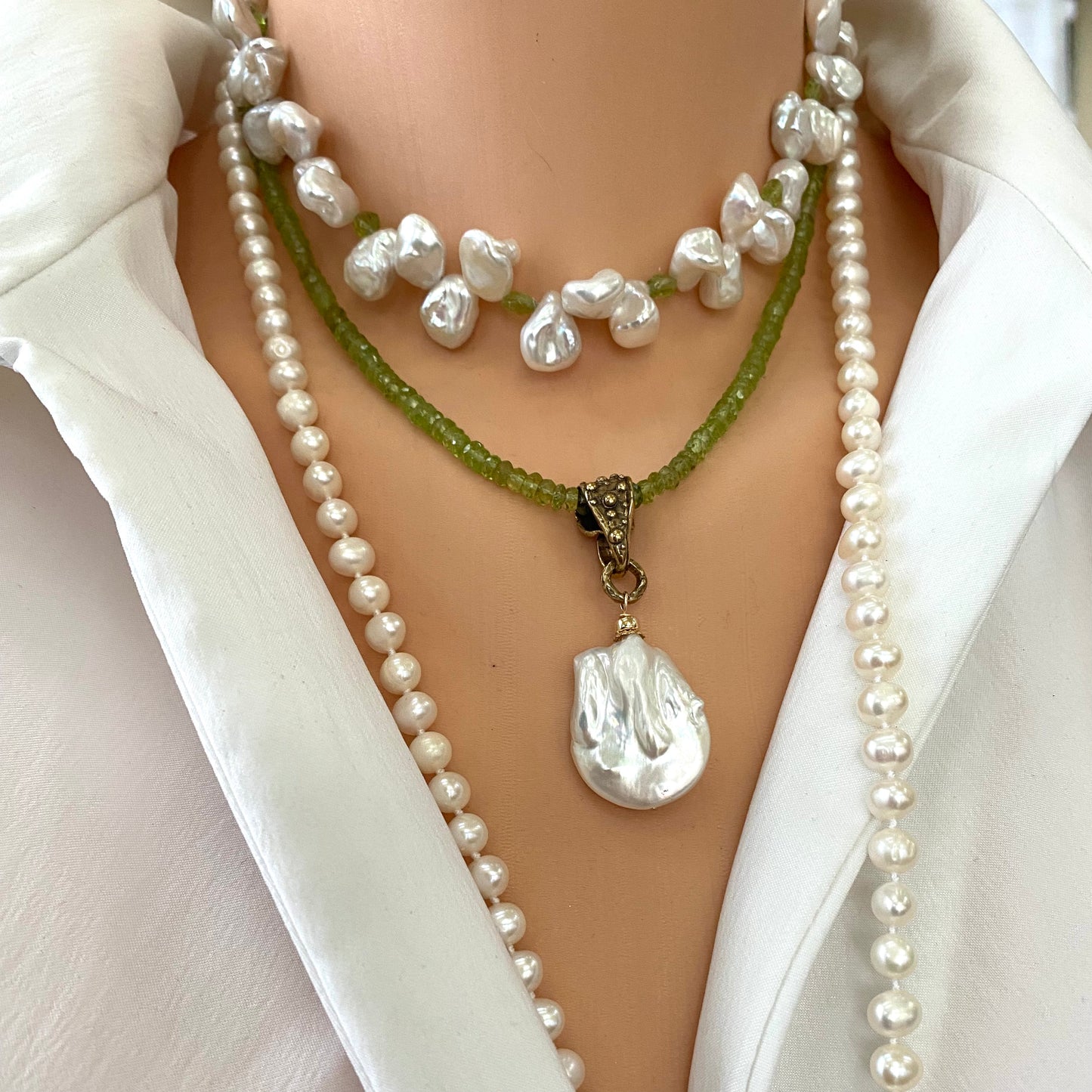 Peridot pearl pendant necklace layered with pearl necklaces featuring removable baroque pearl pendant