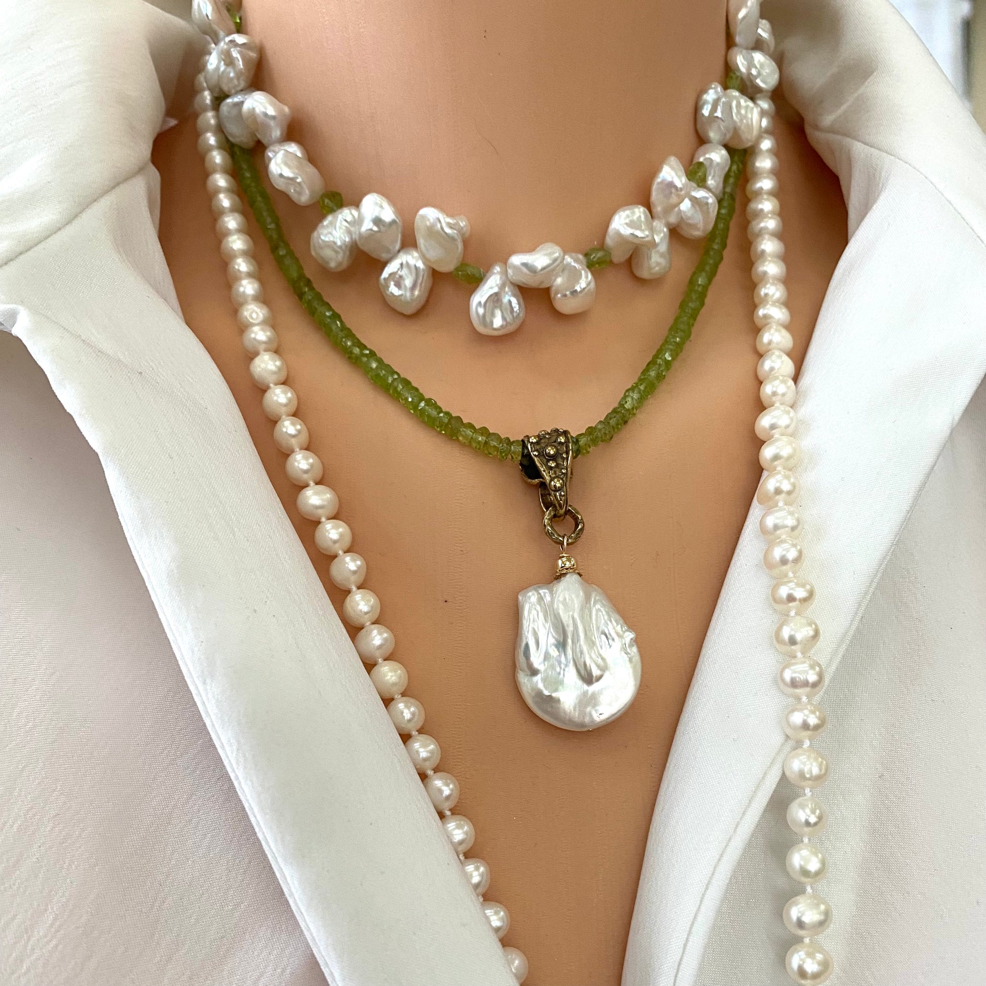 Peridot pearl pendant necklace layered with pearl necklaces featuring removable baroque pearl pendant