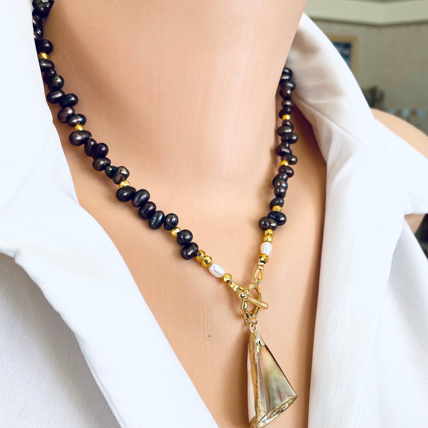 Brown pearl seashell necklace featuring freshwater brown pearls and seashell pendant