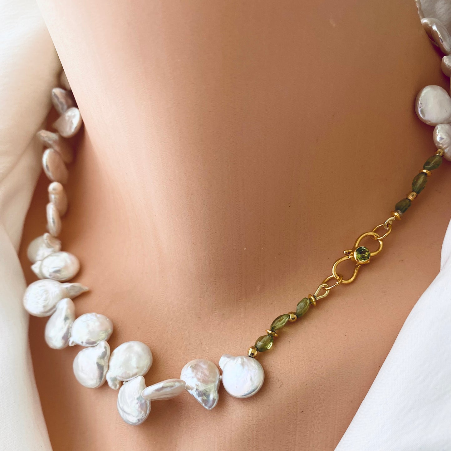 Keshi pearl necklace featuring AAA-quality pearls with a unique shape and green peridot accents.