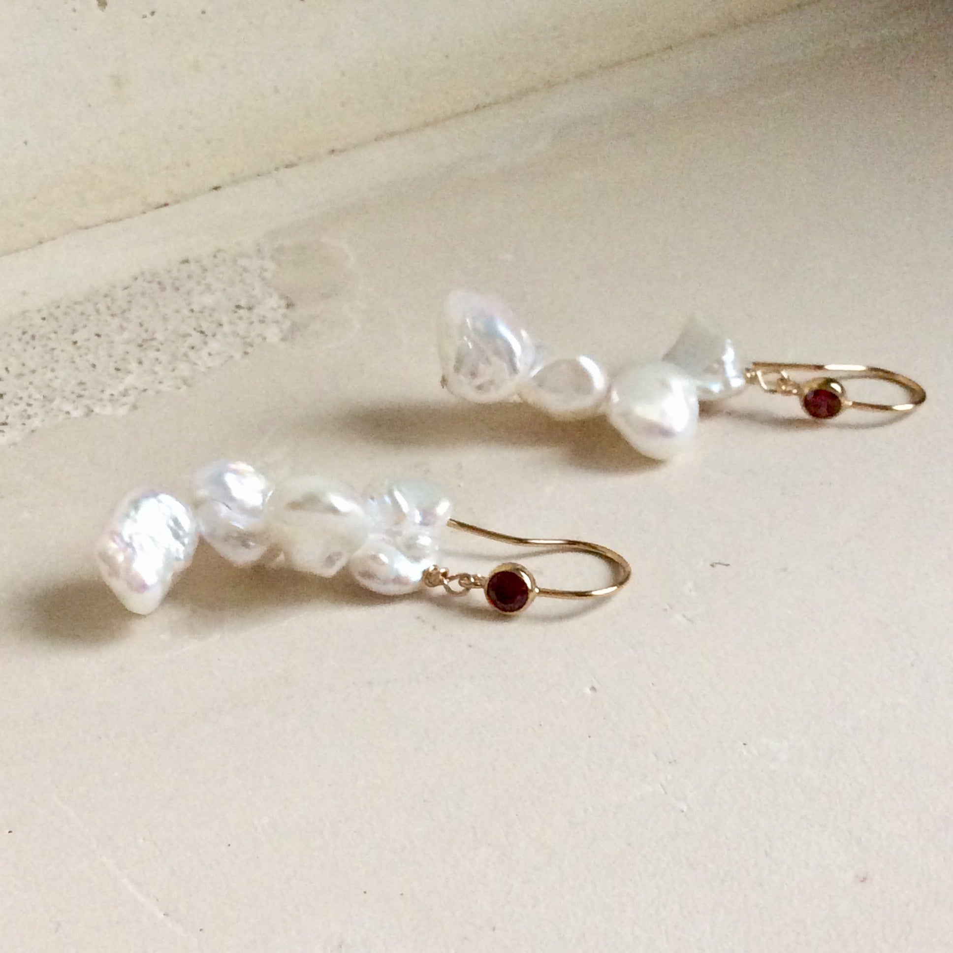 Pearl drop earrings with keshi pearls and deep red CZ, handcrafted in Canada for modern elegance.