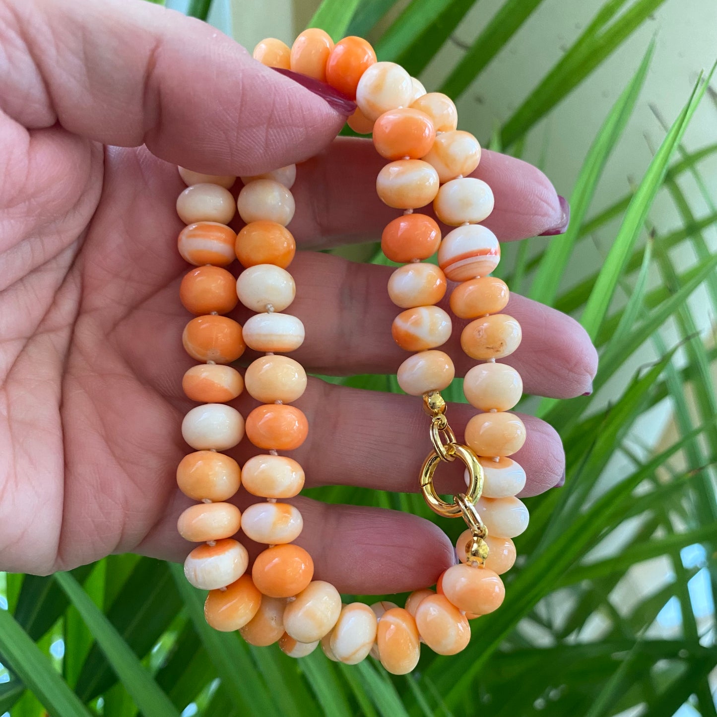 Orange opal candy necklace hand-knotted with rondelle beads and gold clasp, handmade in Canada