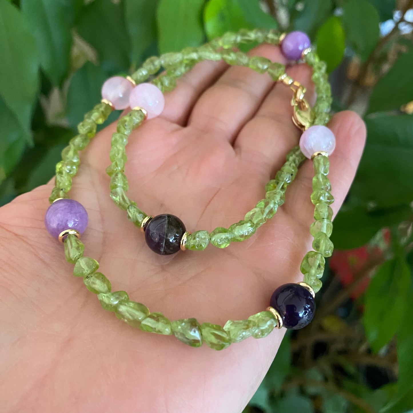 Peridot bonbons necklace with peridot nuggets, rose jade, lilac jade, and amethyst beads, handmade in Canada