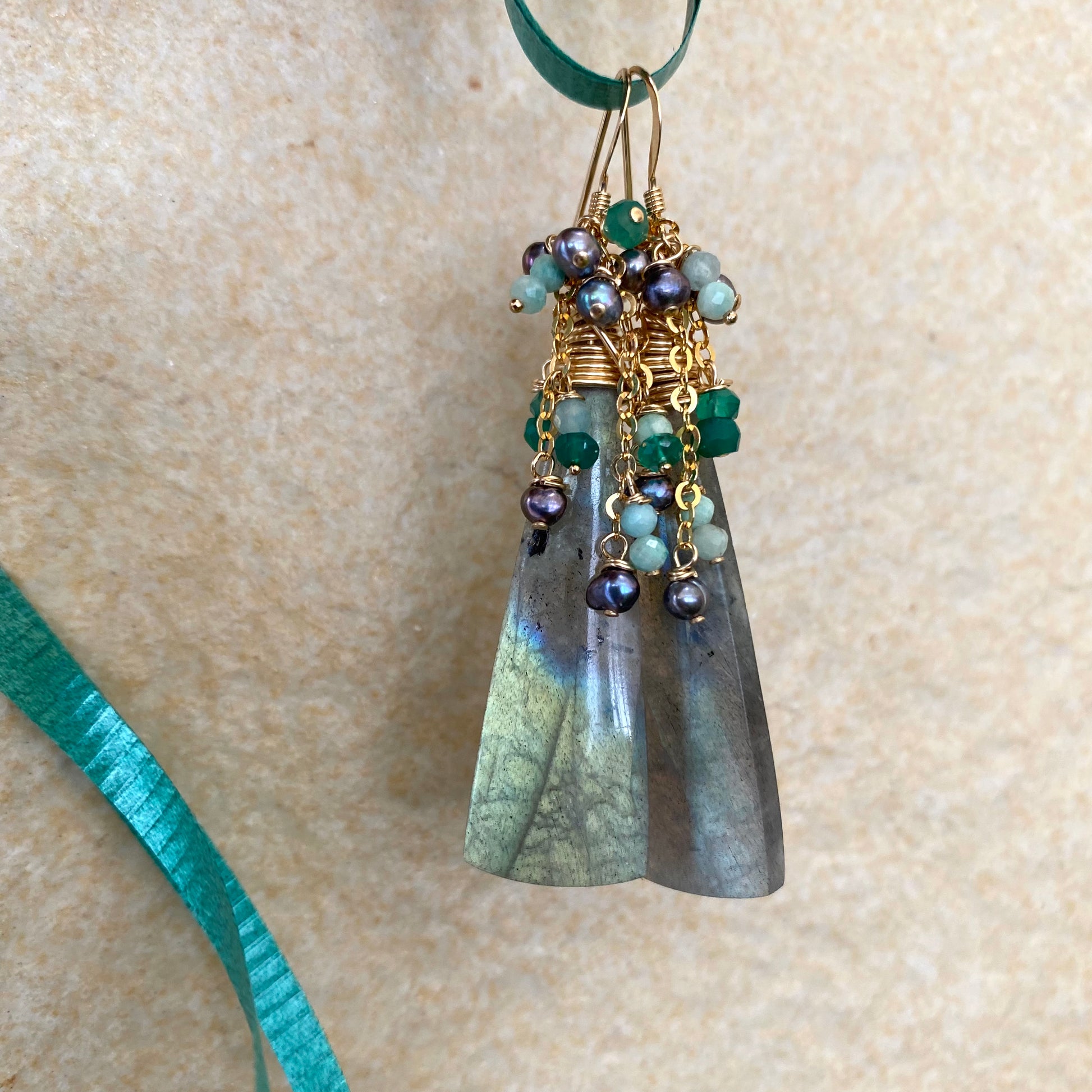 Labradorite amazonite green onyx black pearl earrings close-up showing gemstone texture and pearls