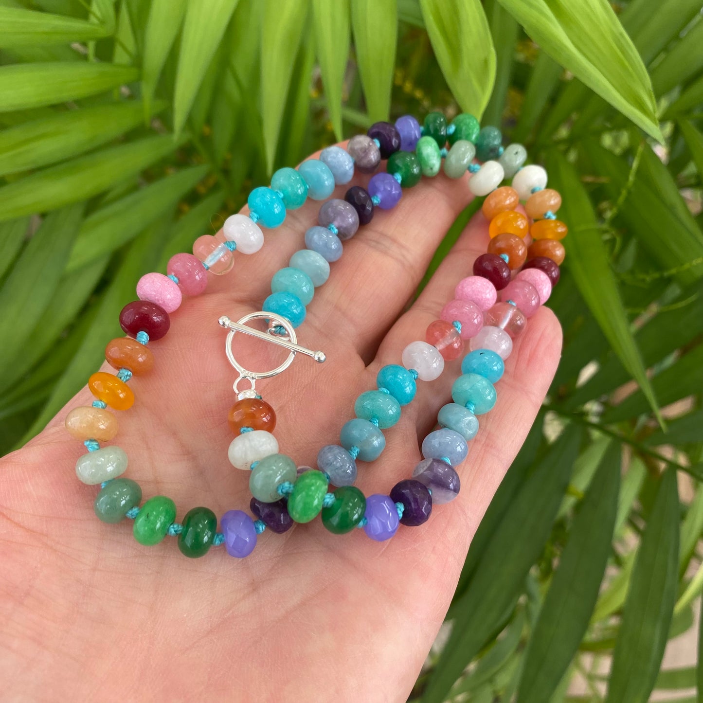 Rainbow candy necklace with silver clasp showcasing colorful gemstone rondelle beads in vibrant hues.