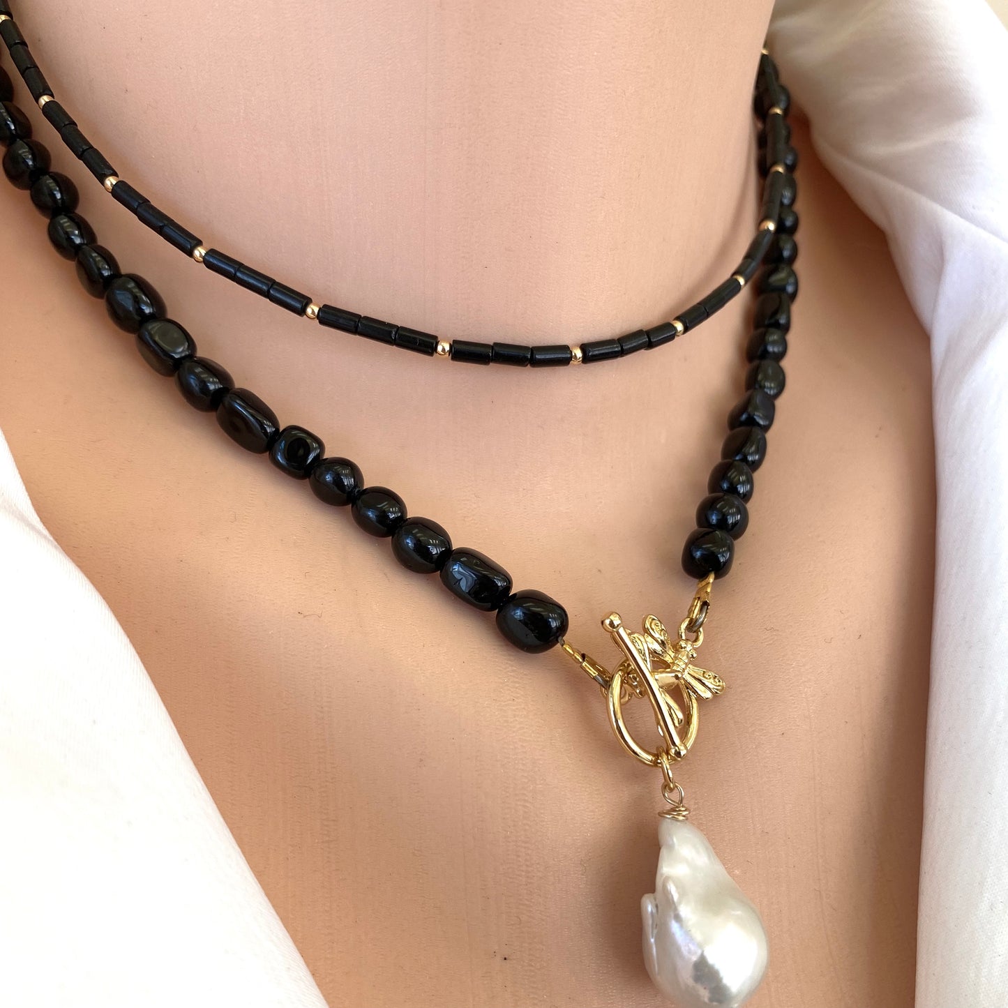 Lapis lazuli onyx choker necklace styled layered with gold pendant necklace