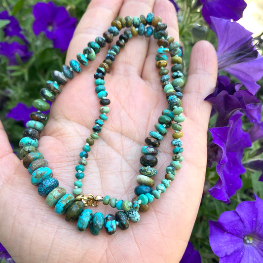 Turquoise necklace gold filled in hand with purple flowers, graduated turquoise candy bead strand