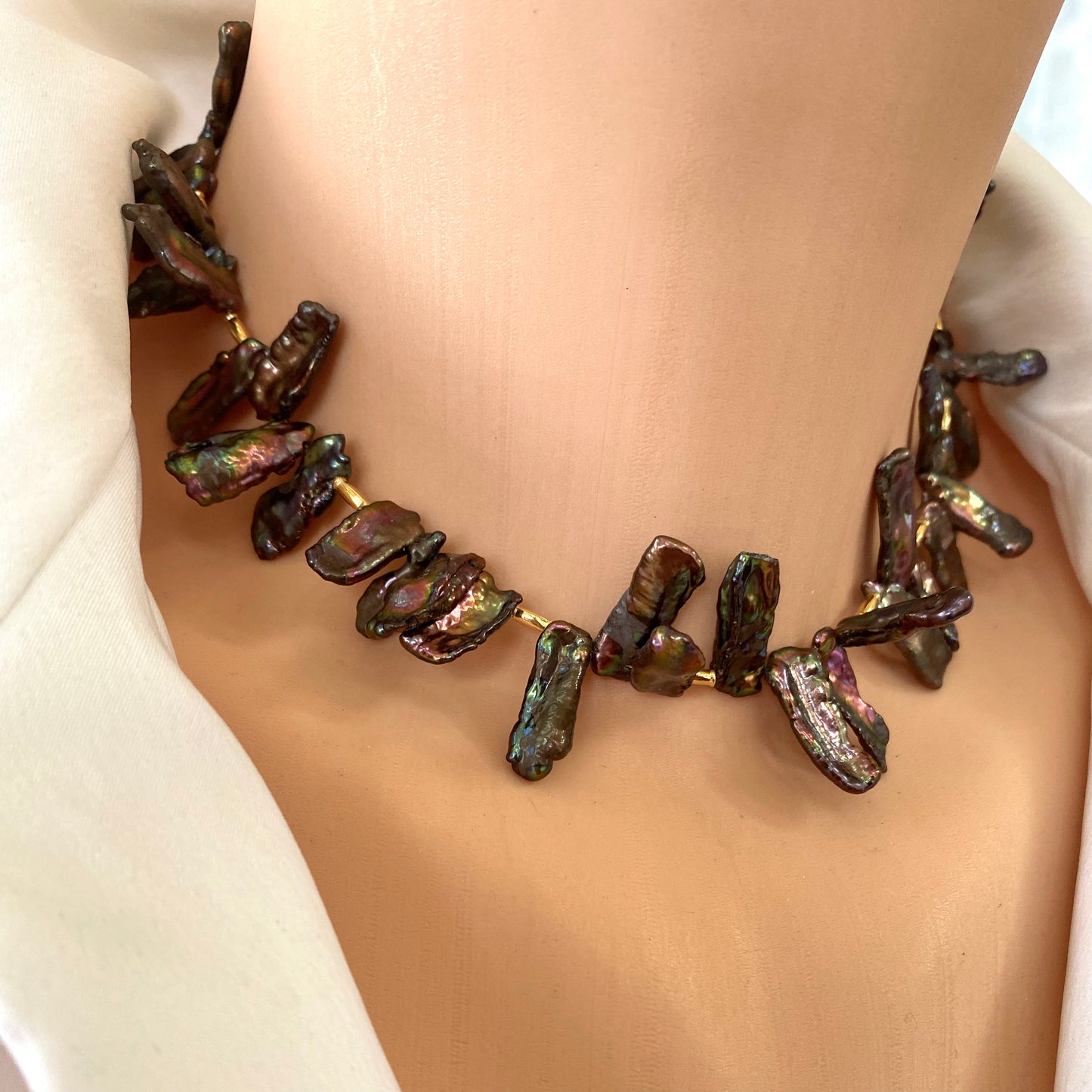 Black pearl choker necklace close-up worn, iridescent Biwa stick pearls with organic texture