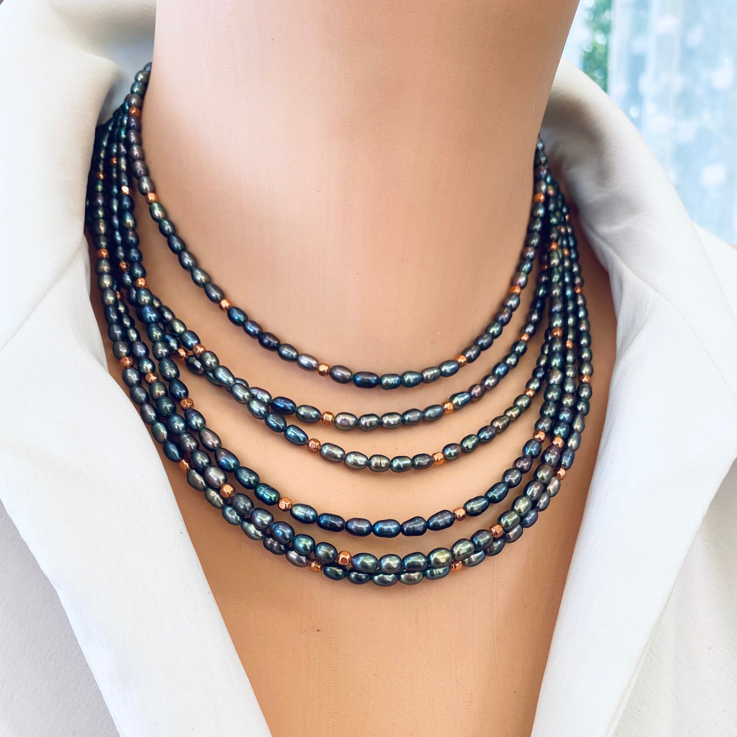 Black pearl necklace gold filled layered on model, mini rice pearls with copper beads for a stacked look