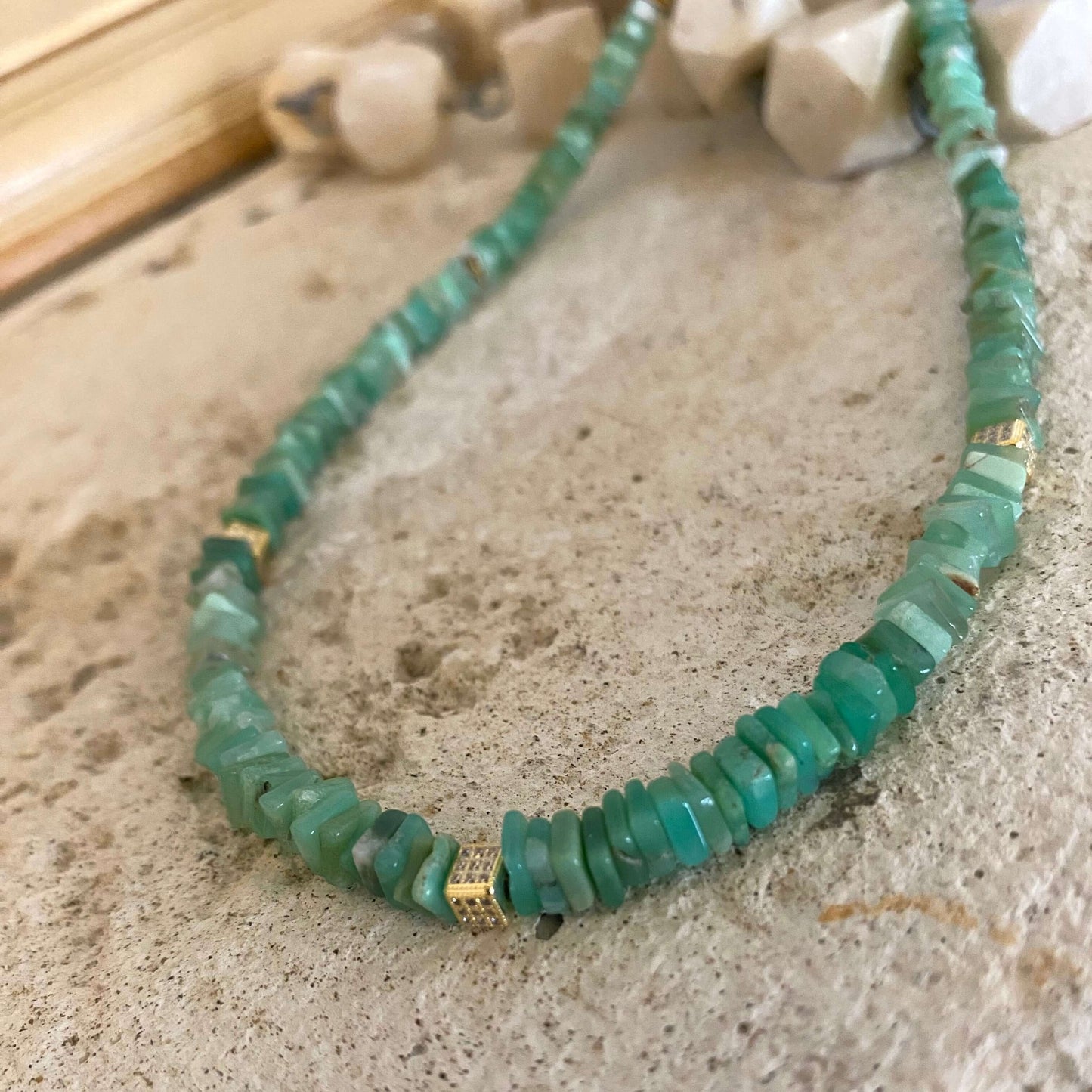 Chrysoprase choker necklace with green heishi beads showcasing vibrant geometric stones.