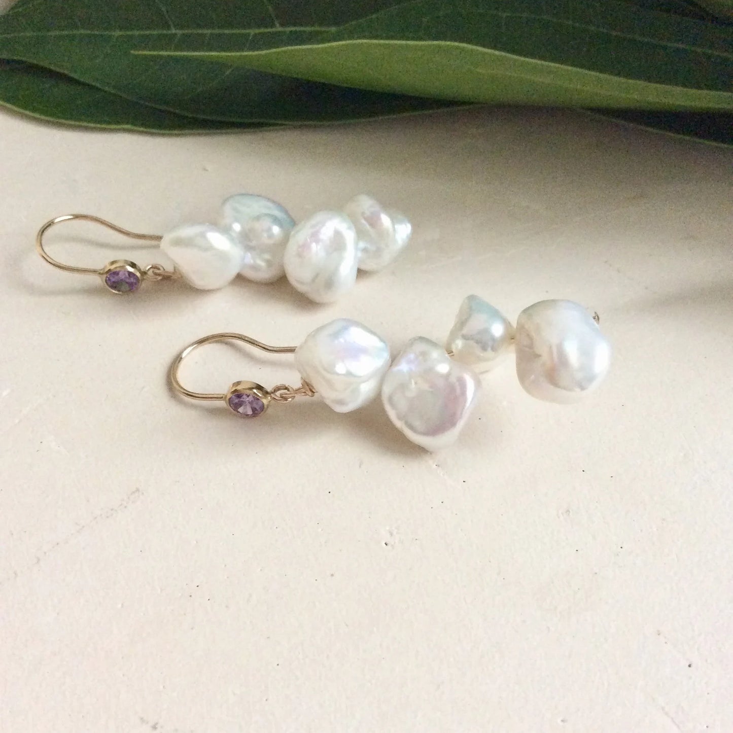 Keshi Pearl Drop Earrings – 14k Gold Filled with Purple CZ and white freshwater keshi pearls, handmade in Canada.