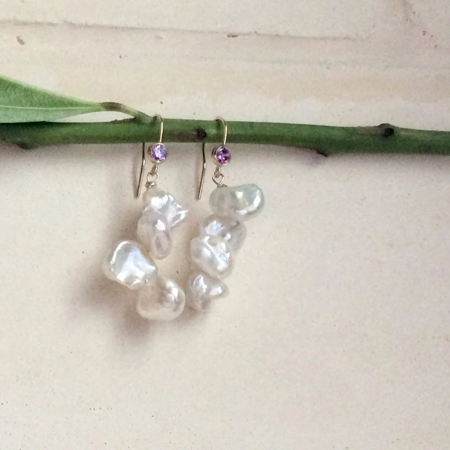 Keshi Pearl Drop Earrings featuring white freshwater pearls and purple CZ accents, handmade in Canada.