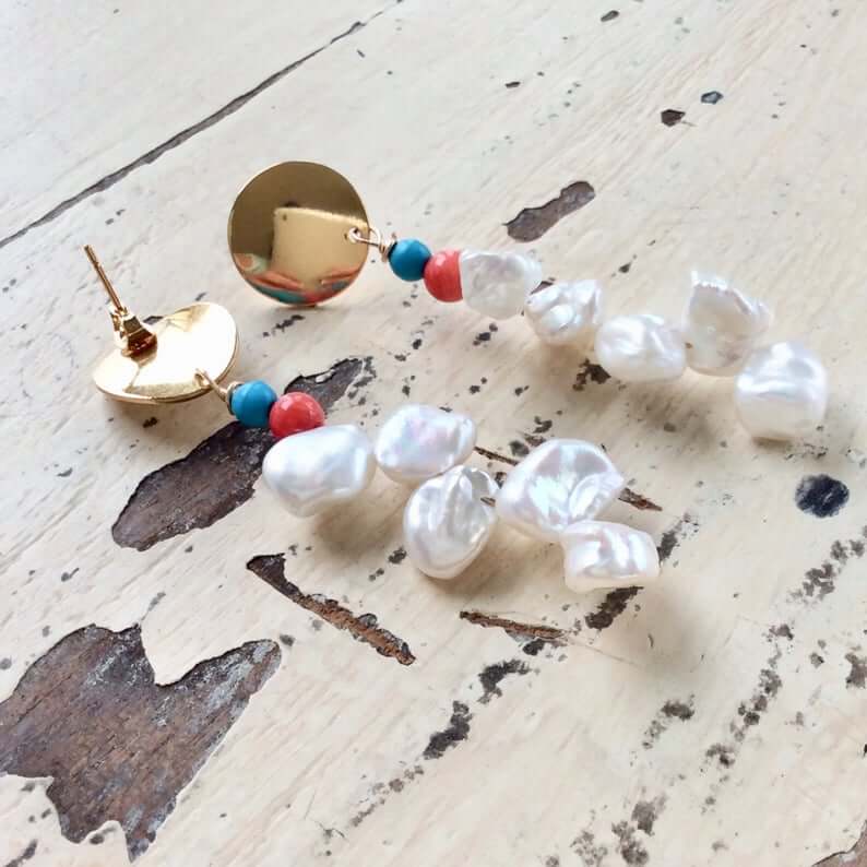 Baroque Keshi Pearl Earrings featuring freshwater pearls, turquoise stones, and red coral beads in gold dangle drop design.