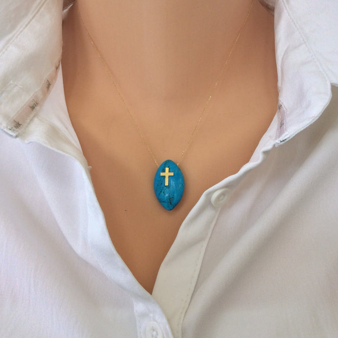 18K gold turquoise cross pendant on minimalist thin chain, showcasing marquise-shaped turquoise stone.